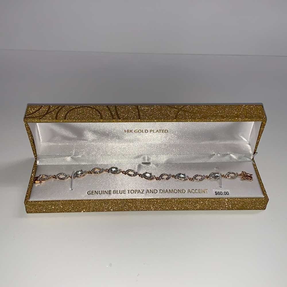 Genuine Blue Topaz And Diamond Accent 18k Gold Plated Bracelet